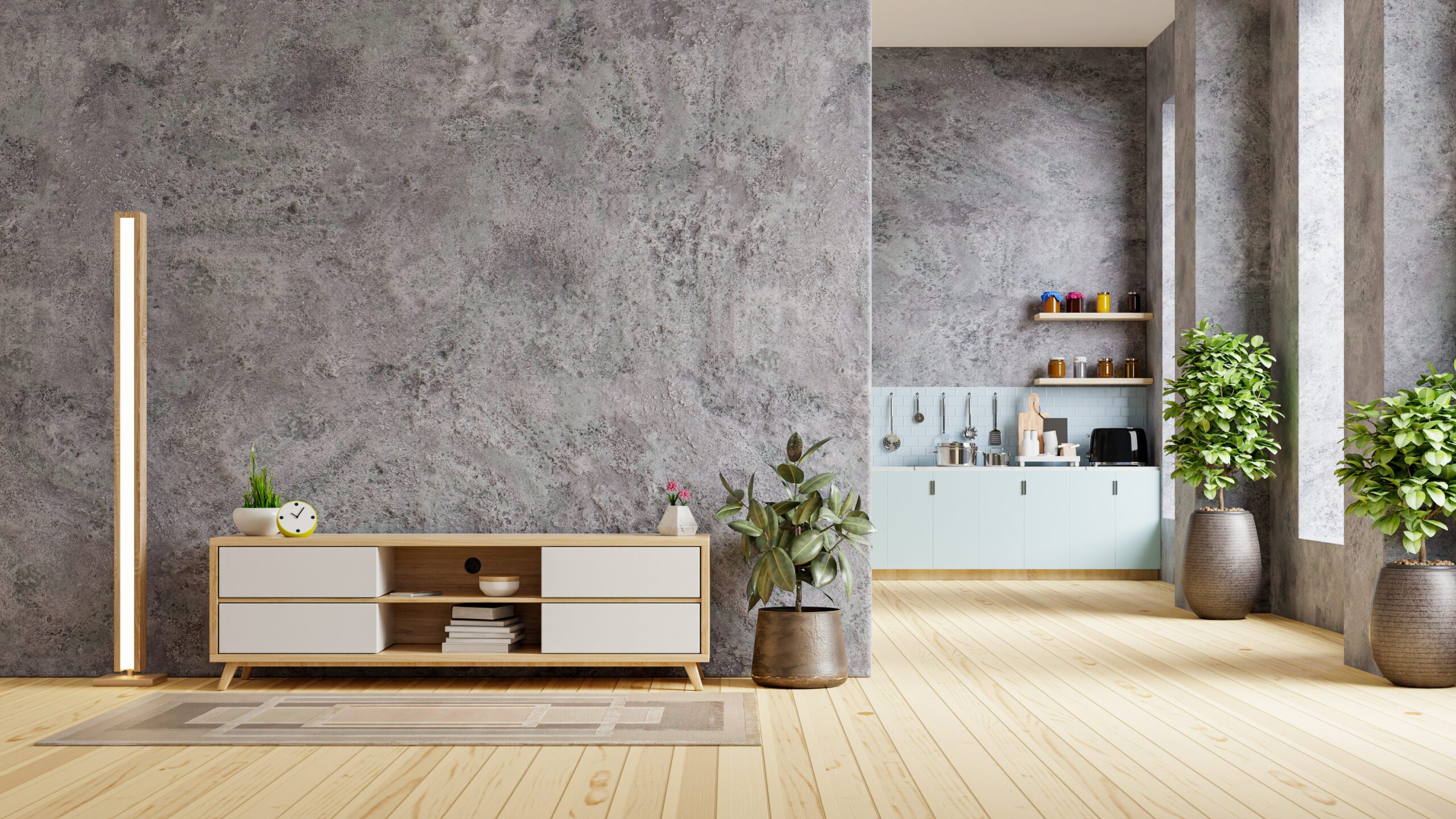 Concrete room interior in warm tones with cabinet for tv which is front the kitchen